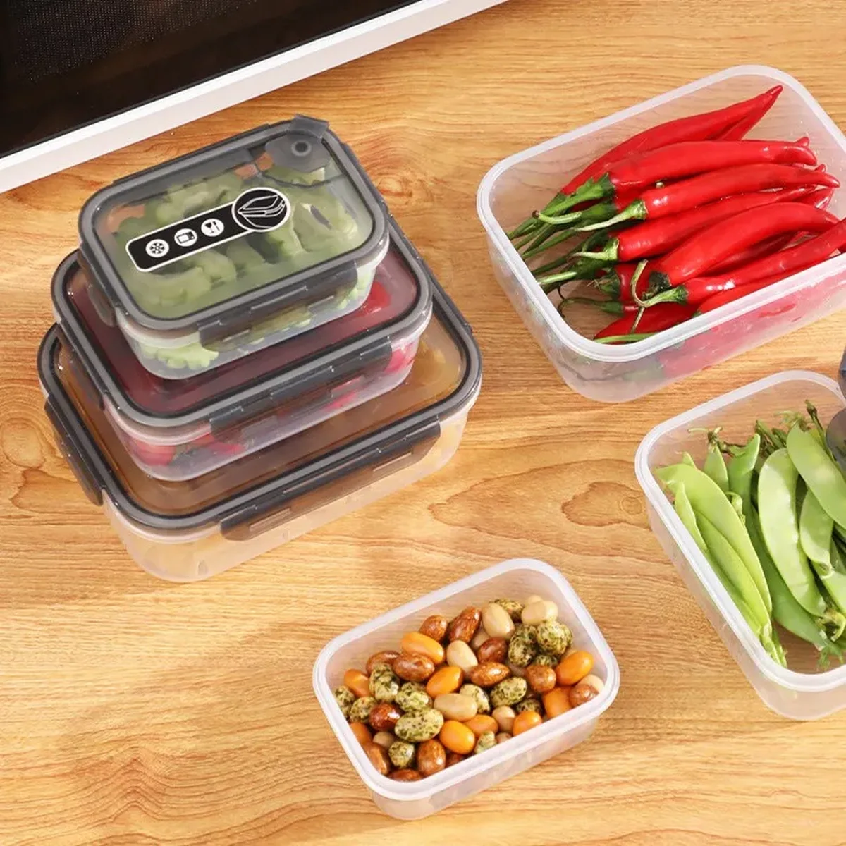 Transparent PP snap-lock food container with a rimmed snap-lock lid, stacked with a second container holding chillies