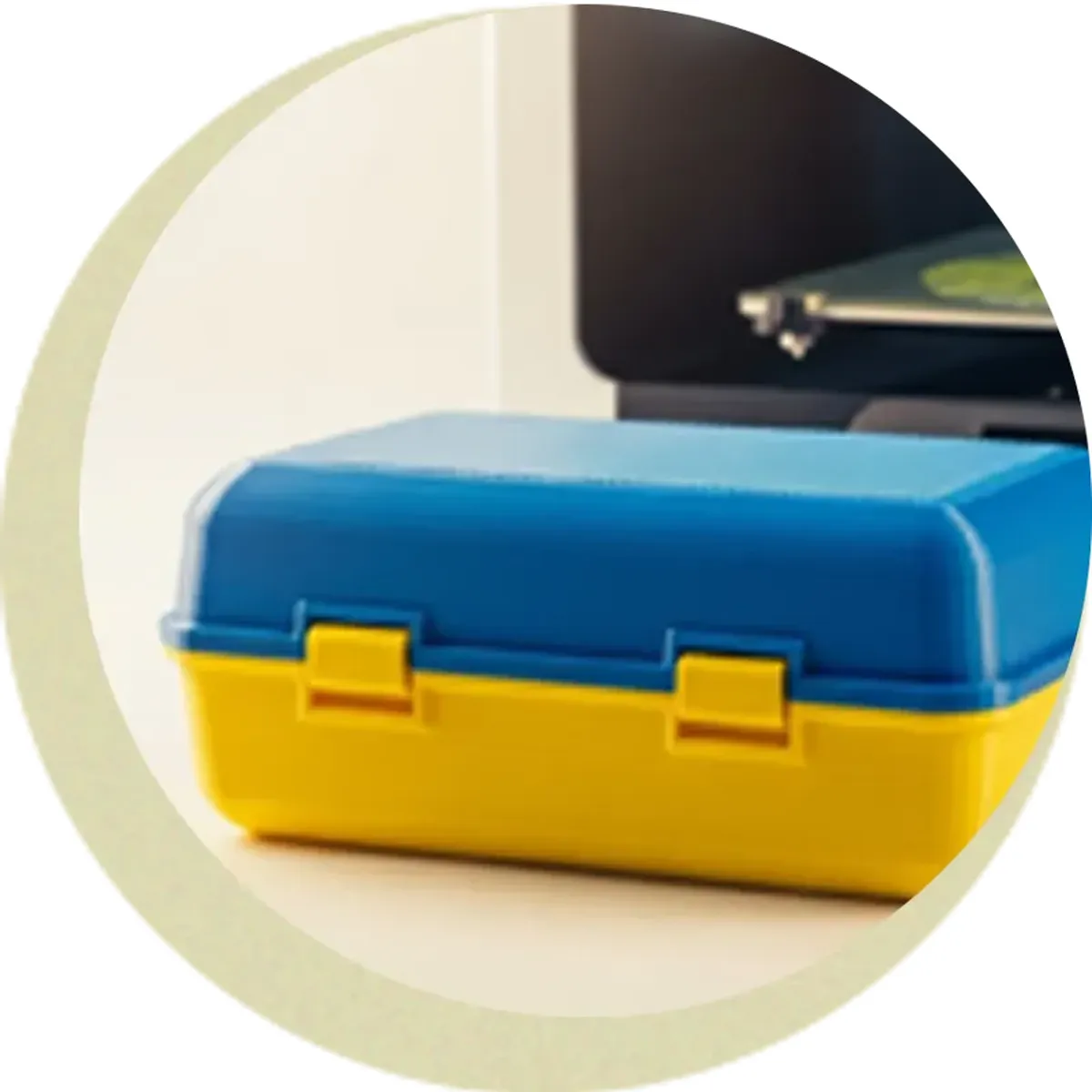 A blue and yellow printed prototype container with two moulded latches, used to check lid fit before tooling
