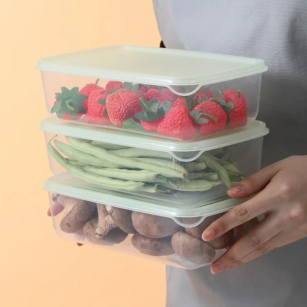 Three stacked rectangular PP food containers with white lids holding strawberries, green beans and mushrooms