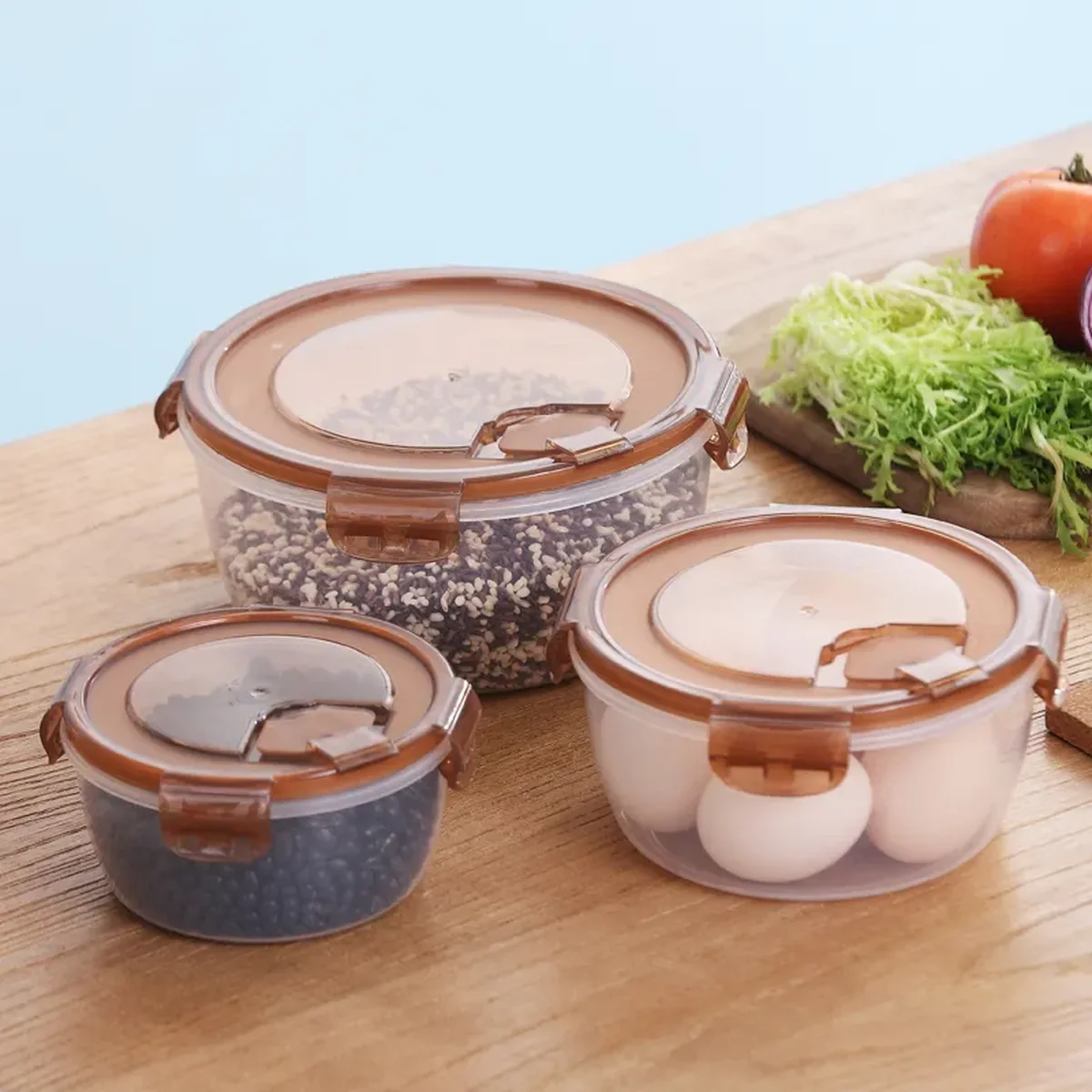 Round PP snap-lock food containers with brown lids holding rice, grains and eggs, the other geometry buyers choose between for a gift set